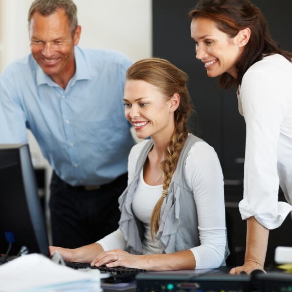 employees looking at computer