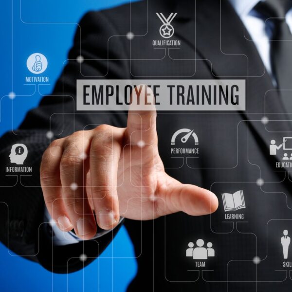 Person tapping a graphic that says "Employee Training."