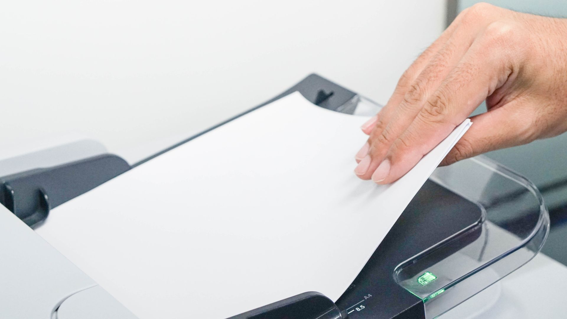 placing paper in a scanner